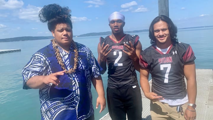 Seniors Louis Filimaua, left, Zaydrius Rainey-Sale, center, and Owen Lago represent Bethel at the inaugural 4A SPSL media day Wednesday in Tacoma.