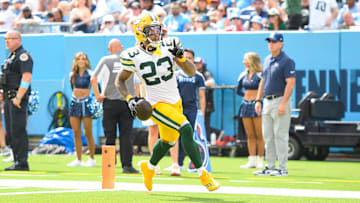 Sep 22, 2024; Nashville, Tennessee, USA;  Green Bay Packers cornerback Jaire Alexander (23) scores on a pick six thrown by Tennessee Titans Will Levis (8) during the first half at Nissan Stadium. Mandatory Credit: Steve Roberts-Imagn Images