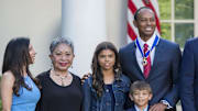 May 6, 2019; Washington, D.C., USA; Tiger Woods poses with his son Charlie Axel Woods, daughter Sam Alexis Woods, mother Kultida Woods, and girlfriend Erica Herman along with U.S. President Donald Trump and First Lady Melania Trump after being presented with the Presidential Medal of Freedom during an event at the White House in the Rose Garden. 