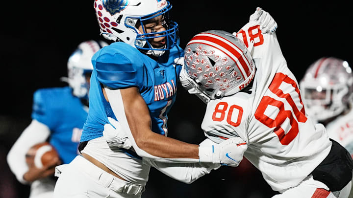 Hamilton Southeastern Royals Donovan Hamilton (1) and Fishers Tigers Carsen Eloms (80) grapple during the final game of class 6A sectionals between Fishers Tigers and Hamilton Southeastern Royals on Friday, Nov. 3, 2023, at Hamilton Southeastern High School in Fishers. Hamilton Southeastern Royals will move on to regionals after beating Fishers Tigers 38-21. Hamilton Southeastern Royals Donovan Hamilton (1) and Fishers Tigers Carsen Eloms (80) grapple during the final game of class 6A sectionals between Fishers Tigers and Hamilton Southeastern Royals on Friday, Nov. 3, 2023, at Hamilton Southeastern High School in Fishers. Hamilton Southeastern Royals will move on to regionals after beating Fishers Tigers 38-21.