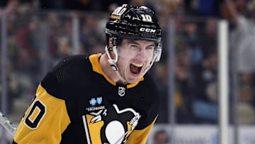 Feb 20, 2024; Pittsburgh, Pennsylvania, USA; Pittsburgh Penguins left wing Drew O'Connor (10) reacts after scoring a goal against the New York Islanders during the third period at PPG Paints Arena. New York won 5-4 in overtime.Mandatory Credit: Charles LeClaire-Imagn Images