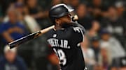 Chicago White Sox center fielder Luis Robert Jr. (88) hits a home run against the Seattle Mariners at T-Mobile Park. 