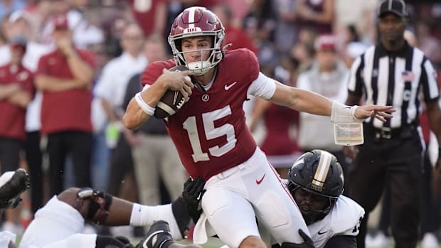 Ty Simpson runs the ball