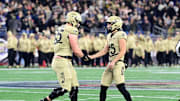 Dec 9, 2023; Foxborough, Massachusetts, USA;  Army Black Knights wide receiver Noah Short (15) celebrates a play with offensive lineman Lucas Scott (65) during the first half against the Navy Midshipmen at Gillette Stadium.