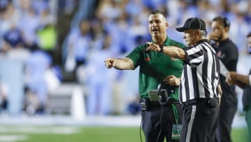 Oct 14, 2023; Chapel Hill, North Carolina, USA; Miami Hurricanes head coach Mario Cristobal argues with an official in the first half against the North Carolina Tar Heels at Kenan Memorial Stadium. Mandatory Credit: Nell Redmond-USA TODAY Sports