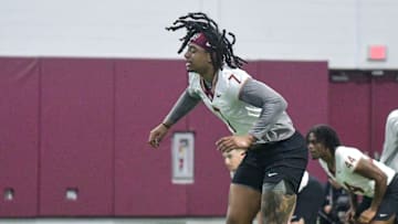 Florida State football players Patrick Payton (11) and Marvin Jones Jr. (7) take part in the final