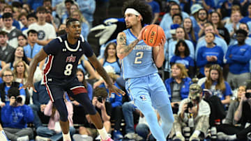 Nov 10, 2024; Omaha, Nebraska, USA;  Creighton Bluejays guard Pop Isaacs (2) looks to pass against Fairleigh Dickinson Knights guard Ahmed Barba-Bey (8) during the first half at CHI Health Center Omaha. Mandatory Credit: Steven Branscombe-Imagn Images