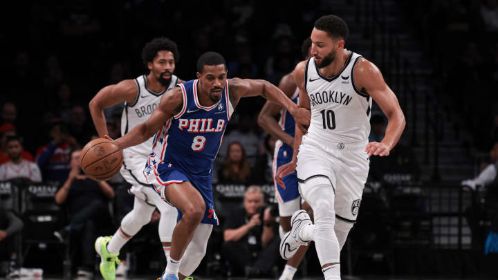 Oct 16, 2023; Brooklyn, New York, USA; Philadelphia 76ers guard De'Anthony Melton (8) dribbles up court against Brooklyn Nets guard Ben Simmons (10) during the first quarter at Barclays Center. Mandatory Credit: Vincent Carchietta-USA TODAY Sports