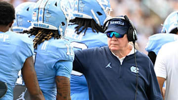 Sep 7, 2024; Chapel Hill, North Carolina, USA;  North Carolina Tar Heels head coach Mack Brown with his players in the second quarter at Kenan Memorial Stadium. Mandatory Credit: Bob Donnan-Imagn Images