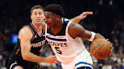 Nov 21, 2025; Phoenix, Arizona, USA; Minnesota Timberwolves guard Anthony Edwards (5) drives to the basket against the Phoenix Suns guard Collin Gillespie (12) in the first half of an NBA Cup game at Mortgage Matchup Center. Mandatory Credit: Mark J. Rebilas-Imagn Images