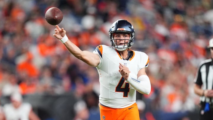 Aug 18, 2024; Denver, Colorado, USA; Denver Broncos quarterback Zach Wilson (4) passes the ball in the second half against the Green Bay Packers at Empower Field at Mile High. 