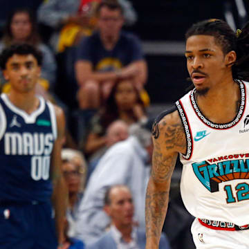 Apr 18, 2025; Memphis, Tennessee, USA; Memphis Grizzlies guard Ja Morant (12) reacts during the second quarter against the Dallas Mavericks at FedExForum.