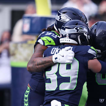 Seattle Seahawks DE DeMarcus Lawrence celebrates after recovering a fumble to score a touchdown against the Arizona Cardinals