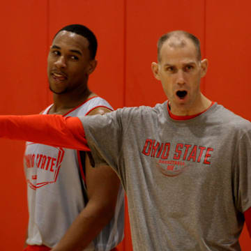 OSU assistant coach Chris Jent encourages players while Jared Sullinger keeps a eye Coach Chris Jent at practice Oct. 19, 2011. (Dispatch photo by Eric Albrecht)