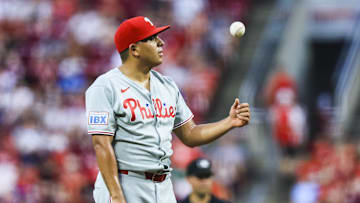 Aug 12, 2025; Cincinnati, Ohio, USA; Philadelphia Phillies starting pitcher Ranger Suarez (55) tosses a ball during a stop in play in the sixth inning against the Cincinnati Reds at Great American Ball Park.