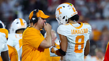 Sep 21, 2024; Norman, Oklahoma, USA; Tennessee Volunteers head coach Josh Heupel (left) speaks with Tennessee Volunteers quarterback Nico Iamaleava (8) during the first half against the Oklahoma Sooners at Gaylord Family-Oklahoma Memorial Stadium. Mandatory Credit: Kevin Jairaj-Imagn Images