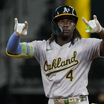 Aug 31, 2024; Arlington, Texas, USA; Oakland Athletics right fielder Lawrence Butler (4) reacts at second base after hitting a double during the sixth inning against the Texas Rangers at Globe Life Field.