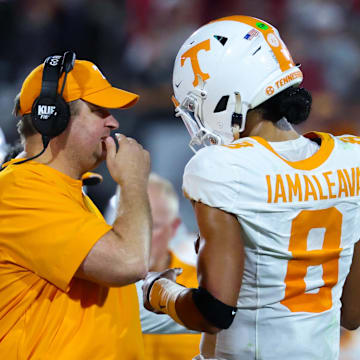 Tennessee Volunteers head coach Josh Heupel (left) speaks with former Tennessee Volunteers quarterback Nico Iamaleava.
