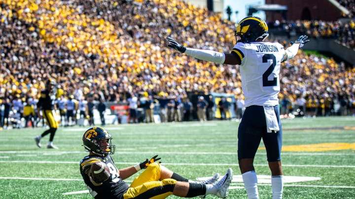 Iowa tight end Sam LaPorta (84) and Michigan defensive back Will Johnson (2) react as a penalty is called on Iowa during a NCAA Big Ten Conference college football game, Saturday, Oct. 1, 2022, at Kinnick Stadium in Iowa City, Iowa.

221001 Mich Iowa Fb 047 Jpg