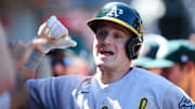 Sep 19, 2021; Anaheim, California, USA; Oakland Athletics third baseman Matt Chapman (26) is greeted after hitting a solo home run against the Los Angeles Angels during the third inning at Angel Stadium. Mandatory Credit: Gary A. Vasquez-Imagn Images