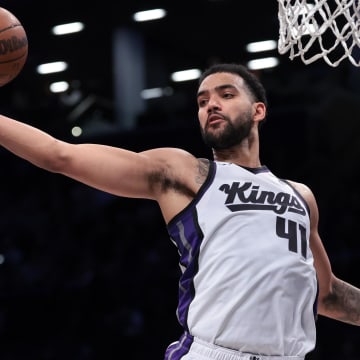 Apr 7, 2024; Brooklyn, New York, USA; Sacramento Kings forward Trey Lyles (41) rebounds during the second half against the Brooklyn Nets at Barclays Center. Mandatory Credit: Vincent Carchietta-USA TODAY Sports