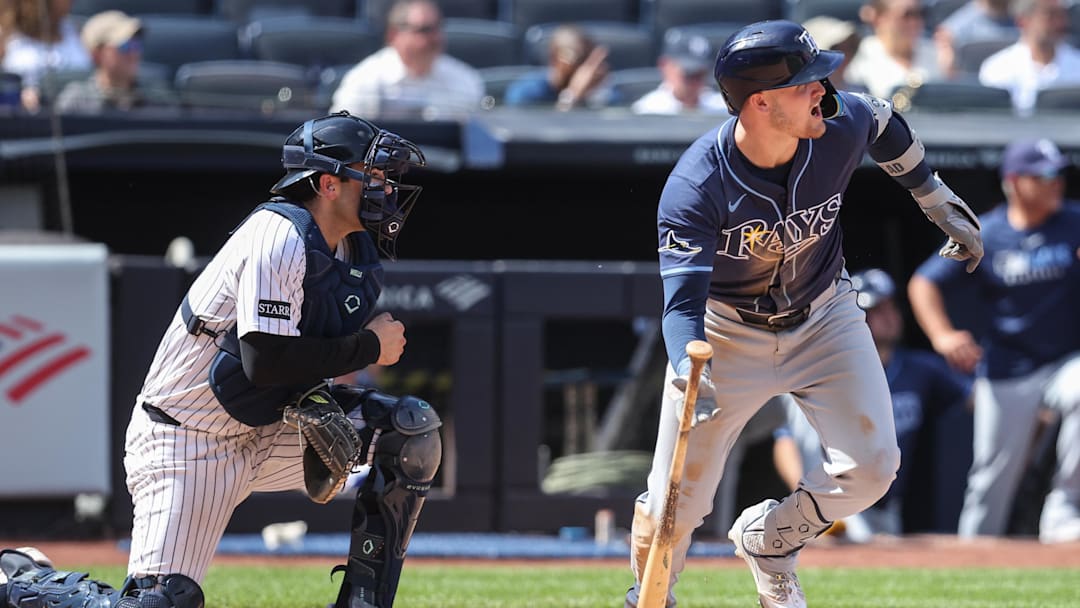 Tampa Bay Rays first baseman Curtis Mead (25) hits an RBI single in the eighth inning against the New York Yankees at Yankee Stadium. 