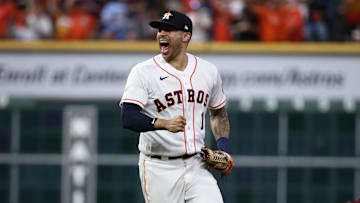 Oct 22, 2021; Houston, Texas, USA; Houston Astros shortstop Carlos Correa (1) celebrates after Boston Red Sox left fielder Alex Verdugo (99) is thrown out at second base by Astros catcher Martin Maldonado (not pictured) in the seventh inning during game six of the 2021 ALCS at Minute Maid Park. Mandatory Credit: Troy Taormina-Imagn Images