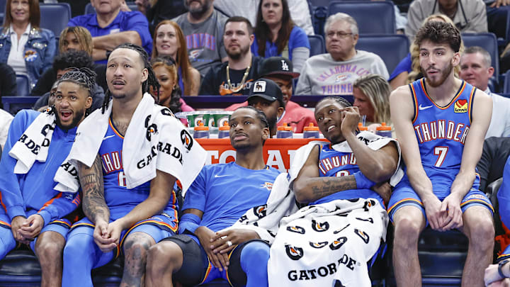 Apr 10, 2024; Oklahoma City, Oklahoma, USA; (L-R) Oklahoma City Thunder guard Isaiah Joe (11) and forward Jaylin Williams (6) and guard Shai Gilgeous-Alexander (2) and forward Jalen Williams (8) and forward Chet Holmgren (7) watch their team play against the San Antonio Spurs during the second half at Paycom Center. Mandatory Credit: Alonzo Adams-Imagn Images