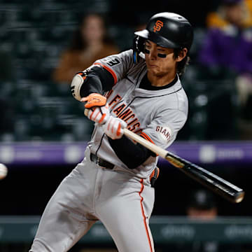 May 7, 2024; Denver, Colorado, USA; San Francisco Giants center fielder Jung Hoo Lee (51) hits a single in the eighth inning against the Colorado Rockies at Coors Field. =