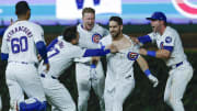 Aug 1, 2024; Chicago, Illinois, USA; Chicago Cubs outfielder Mike Tauchman (40) celebrates with teammates his walk-off single against the St. Louis Cardinals during the ninth inning at Wrigley Field. 