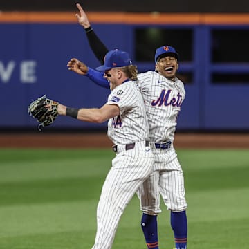 Sep 3, 2024; New York City, New York, USA;  New York Mets center fielder Harrison Bader (44) and shortstop Francisco Lindor (12) celebrate after defeating the Boston Red Sox at Citi Field.