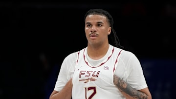 Mar 11, 2025; Charlotte, NC, USA; Florida State Seminoles forward Malique Ewin (12) on the court in the first half at Spectrum Center. Mandatory Credit: Bob Donnan-Imagn Images