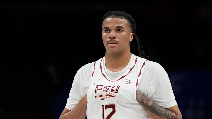 Mar 11, 2025; Charlotte, NC, USA; Florida State Seminoles forward Malique Ewin (12) on the court in the first half at Spectrum Center. Mandatory Credit: Bob Donnan-Imagn Images