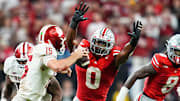 Ohio State Buckeyes linebacker Sonny Styles pressures Indiana Hoosiers quarterback Fernando Mendoza in the Big Ten Championship 