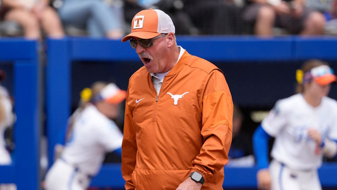 Texas Longhorns head coach Mike White shouts during a Women's College World Series softball game.