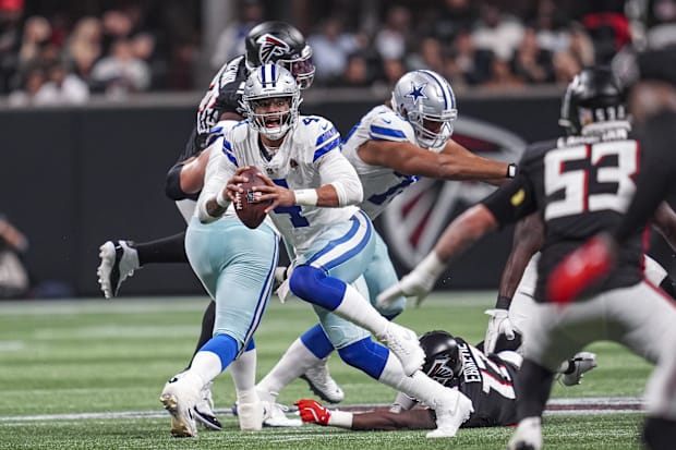 Dallas Cowboys quarterback Dak Prescott runs out of the pocket against the Atlanta Falcons