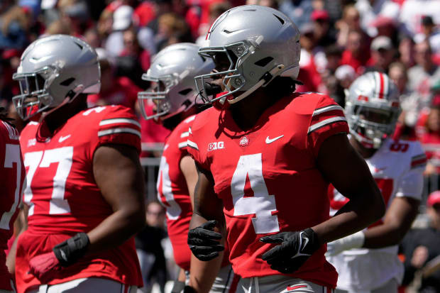 Wide receiver jogs to spot before play in spring game.