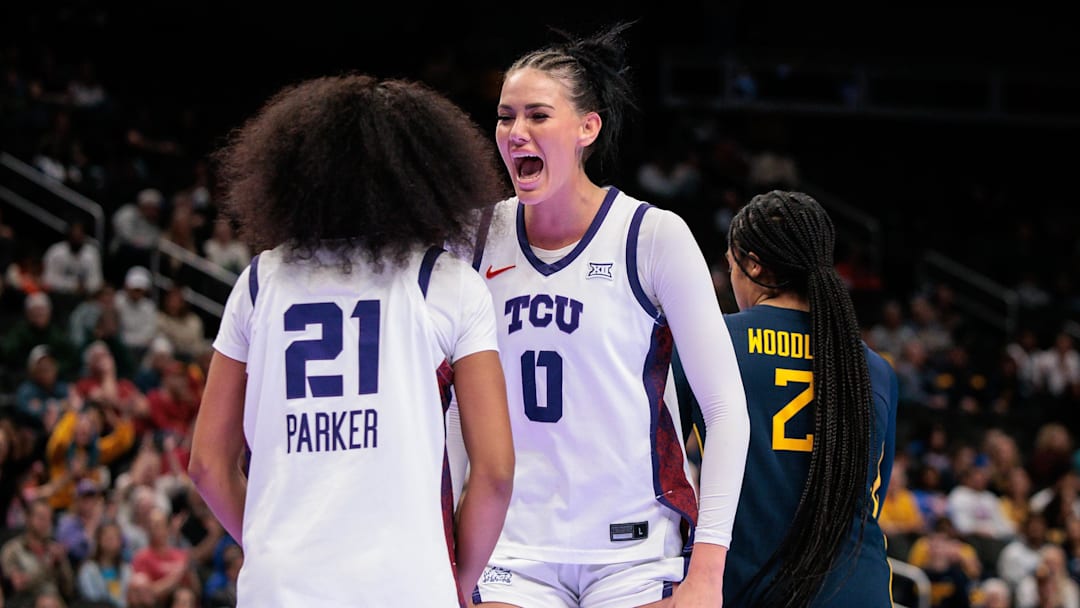 Mar 8, 2026; Kansas City, MO, USA; TCU Horned Frogs center Kennedy Basham (0) reacts after a play with TCU Horned Frogs guard Taliyah Parker (21) during the second half against the West Virginia Mountaineers at T-Mobile Center. Mandatory Credit: William Purnell-Imagn Images