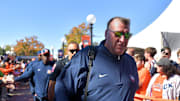 Oct 19, 2024; Champaign, Illinois, USA; Illinois Fighting Illini head coach Bret Bielema leads his team into the stadium before kickoff against the Michigan Wolverines game at Memorial Stadium. Mandatory Credit: Ron Johnson-Imagn Images