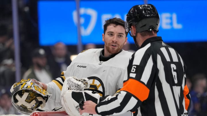 Apr 24, 2024; Toronto, Ontario, CAN; Boston Bruins goaltender Jeremy Swayman (1) talks to NHL referee Francis Charron (6) during a break in the action against the Toronto Maple Leafs during the third period of game three of the first round of the 2024 Stanley Cup Playoffs at Scotiabank Arena. Mandatory Credit: John E. Sokolowski-USA TODAY Sports