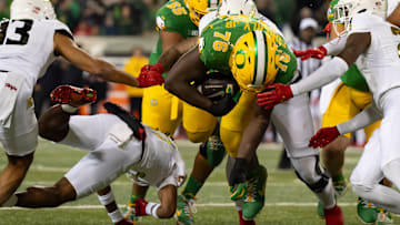 Oregon offensive lineman Josh Conerly Jr. dives in for a two-point conversion as the Oregon Ducks host the Maryland Terrapins at Autzen Stadium Saturday, Nov. 9, 2024 in Eugene, Ore.