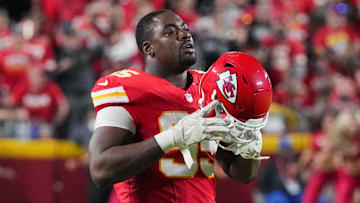 Oct 7, 2024; Kansas City, Missouri, USA; Kansas City Chiefs defensive tackle Chris Jones (95) removes his helmet during a timeout against the New Orleans Saints during the game at GEHA Field at Arrowhead Stadium. Mandatory Credit: Denny Medley-Imagn Images