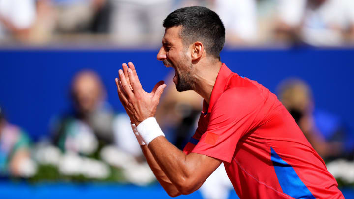 Aug 4, 2024; Paris, France; Novak Djokovic (SRB) reacts after winning the men’s singles gold medal match against Carlos Alcaraz (not pictured) during the Paris 2024 Olympic Summer Games at Stade Roland Garros. Mandatory Credit: Amber Searls-USA TODAY Sports