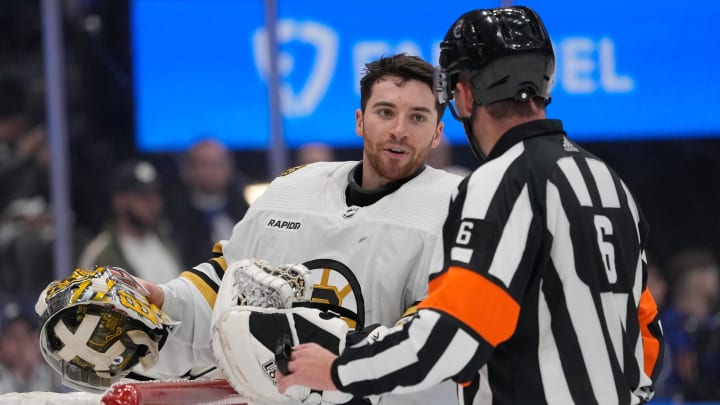 Apr 24, 2024; Toronto, Ontario, CAN; Boston Bruins goaltender Jeremy Swayman (1) talks to NHL referee Francis Charron (6) during a break in the action against the Toronto Maple Leafs during the third period of game three of the first round of the 2024 Stanley Cup Playoffs at Scotiabank Arena. Mandatory Credit: John E. Sokolowski-USA TODAY Sports