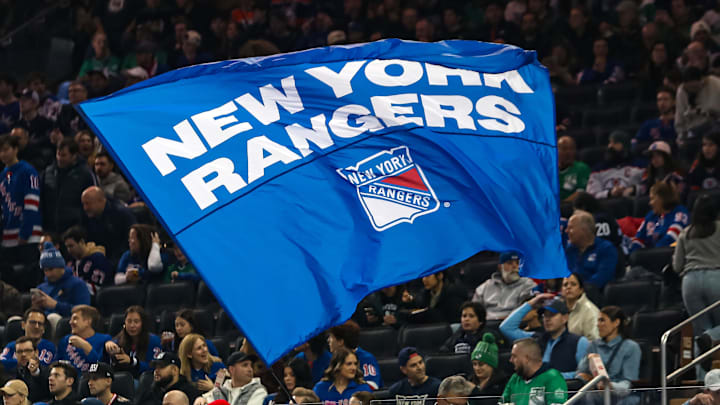 Mar 16, 2025; New York, New York, USA; A New York Rangers flag is seen in the crown during the first period against the Edmonton Oilers at Madison Square Garden. 