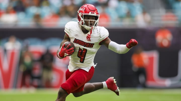 Nov 18, 2023; Miami Gardens, Florida, USA; Louisville Cardinals running back Maurice Turner (4) runs with the football