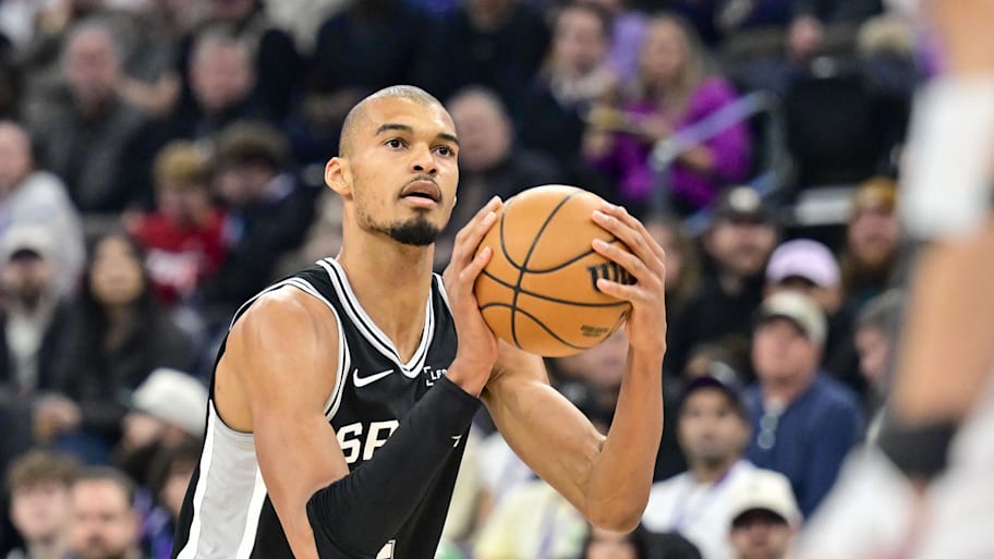 Spurs forward/center Victor Wembanyama takes a three-point shot.