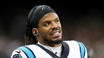 Jan 2, 2022; New Orleans, Louisiana, USA; Carolina Panthers quarterback Cam Newton (1) on the sidelines in the second quarter against the New Orleans Saints at the Caesars Superdome. Mandatory Credit: Chuck Cook-Imagn Images