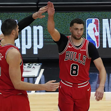 May 7, 2021; Chicago, Illinois, USA; Chicago Bulls guard Zach LaVine (8) celebrates his three point basket against the Boston Celtics with center Nikola Vucevic (9) during the second half at United Center.