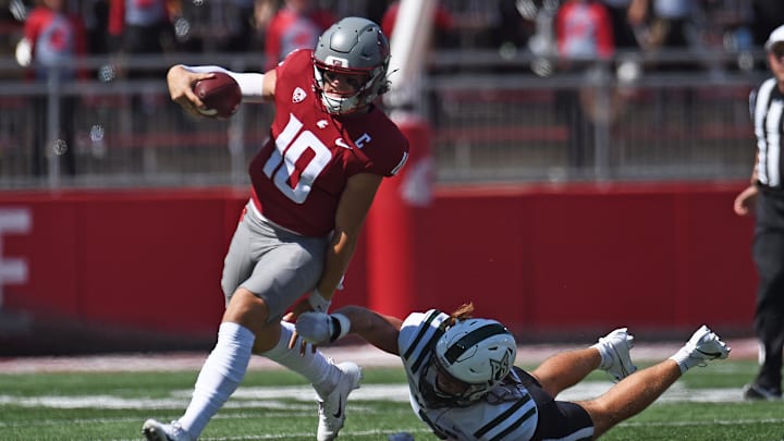 Aug 31, 2024; Pullman, Washington, USA; Washington State Cougars quarterback John Mateer (10) breaks away from Portland State Vikings linebacker Peyton Wing (7) in the first half at Gesa Field at Martin Stadium. Mandatory Credit: James Snook-Imagn Images